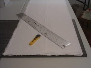 Folded, pre-shrunk muslin on cutting mat Folded, pre-shrunk muslin on cutting mat