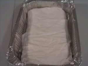 Soaking muslin strips in starch/water solution Soaking muslin strips in starch/water solution