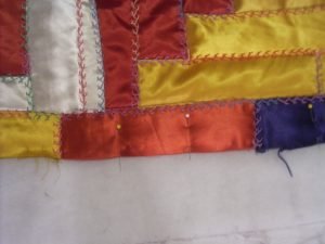 Stitching down border seams