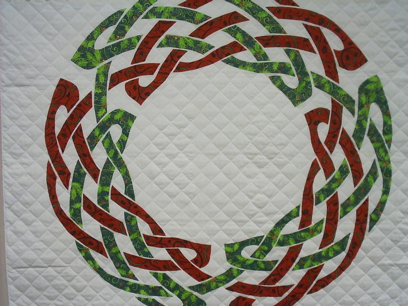 Red and green circular Celtic knot.