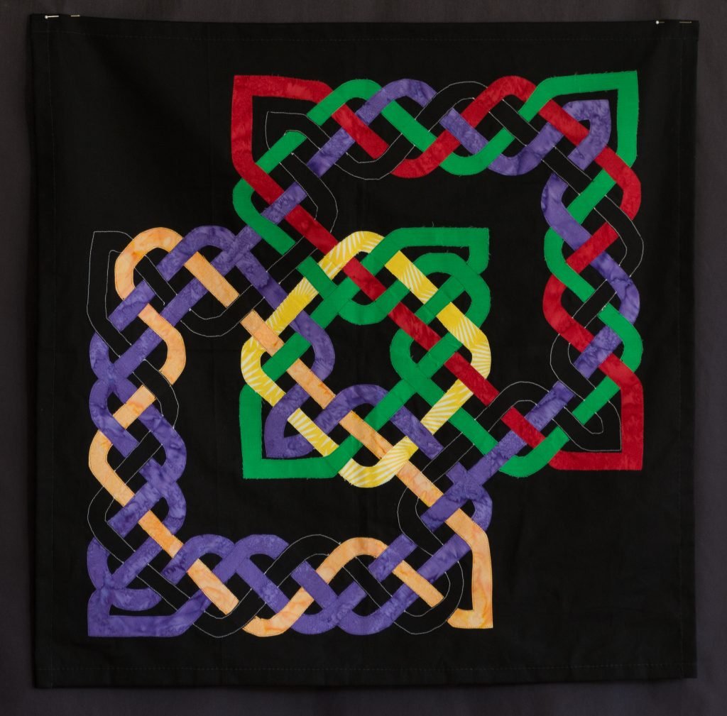 Multi-colored intersecting Celtic knots.