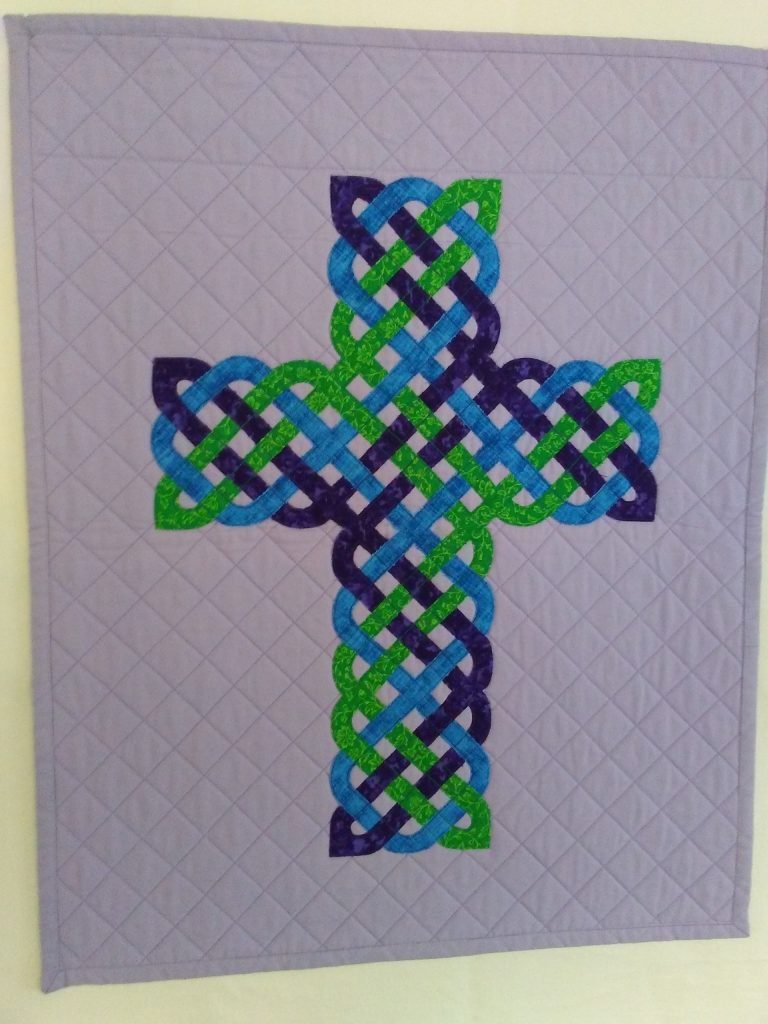 Blue, green and purple Celtic knot cross.