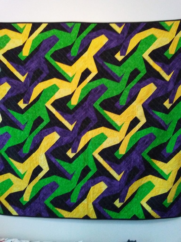 Interlocking purple, green and yellow men.