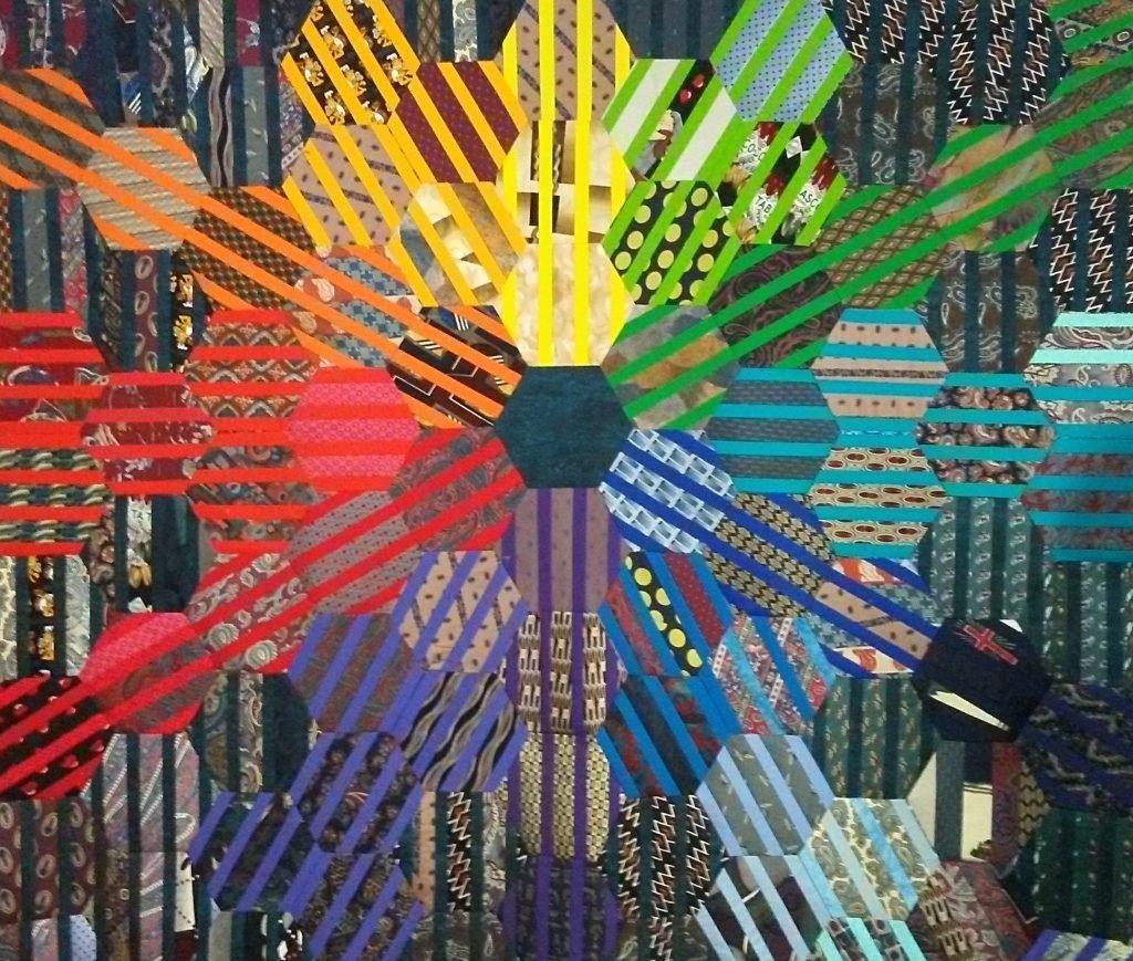 Striped hexagons form a color wheel.