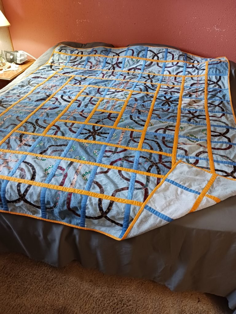 Silk knotwork on recycled denim.