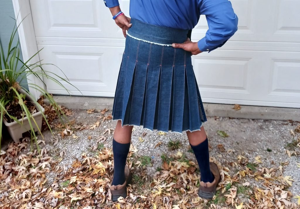 Rear-view denim kilt.
